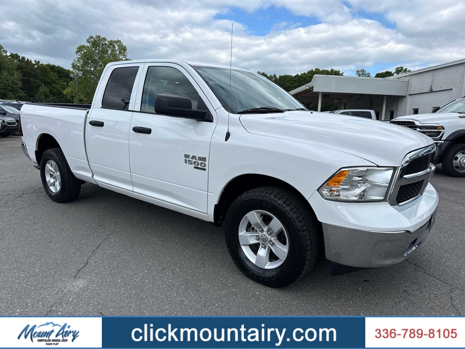 2024 RAM 1500 Classic SLT Quad Cab 4x4 6'4' Box in Bright White Clearcoat — front three-quarter view