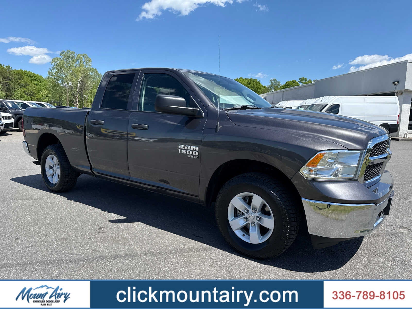 2024 RAM 1500 Classic SLT Quad Cab 4x4 6'4' Box in Granite Crystal Metallic Clearcoat — front three-quarter view