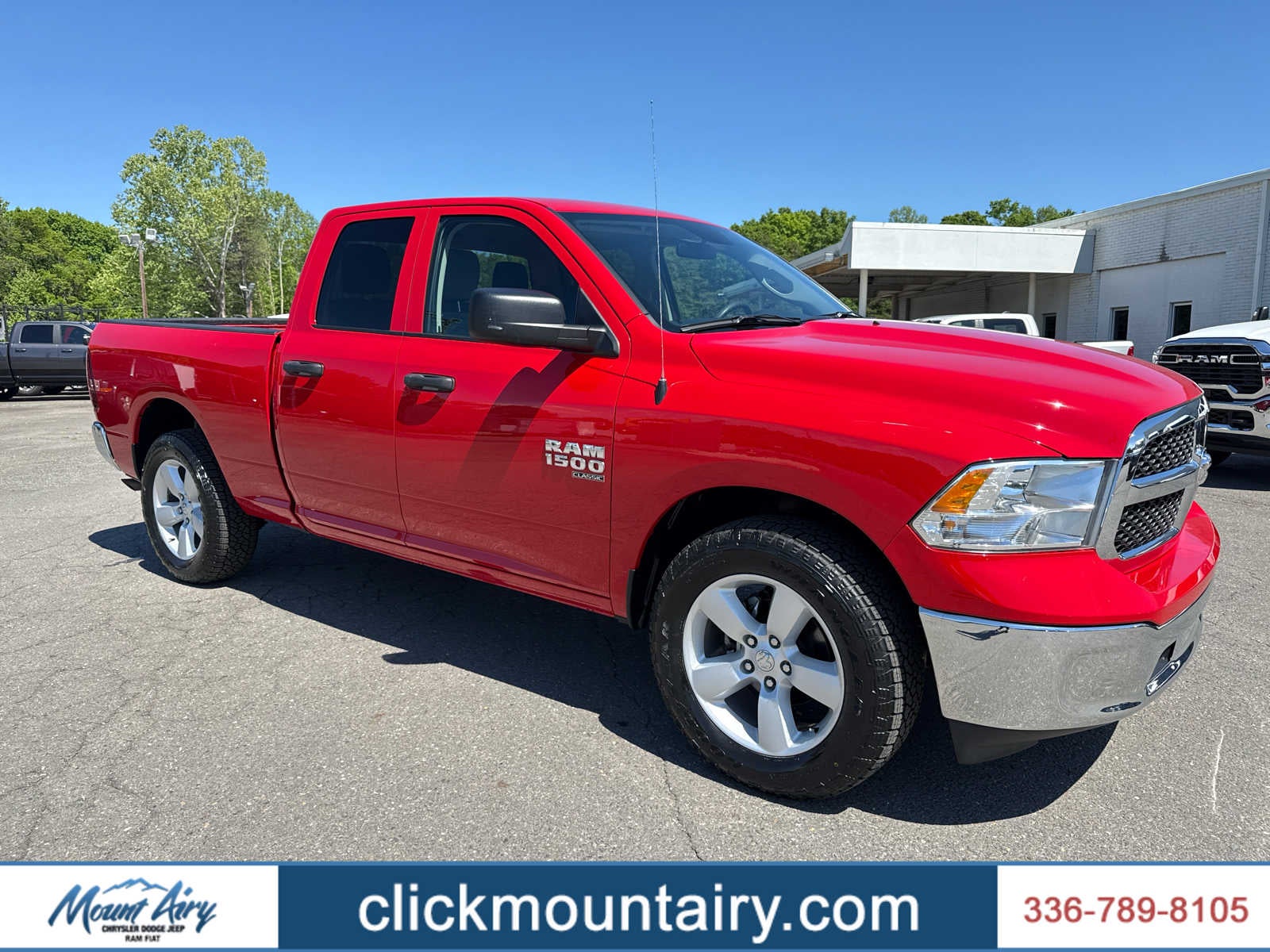2024 RAM 1500 Classic SLT Quad Cab 4x4 6'4' Box in Flame Red Clearcoat — front three-quarter view