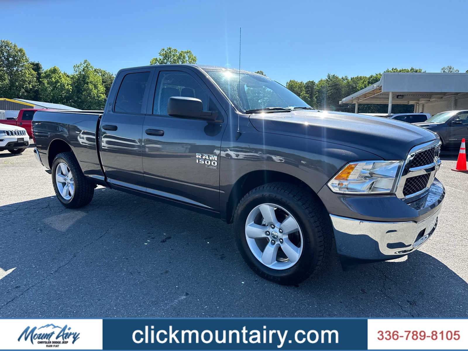 2024 RAM 1500 Classic SLT Quad Cab 4x4 6'4' Box in Granite Crystal Metallic Clearcoat — front three-quarter view