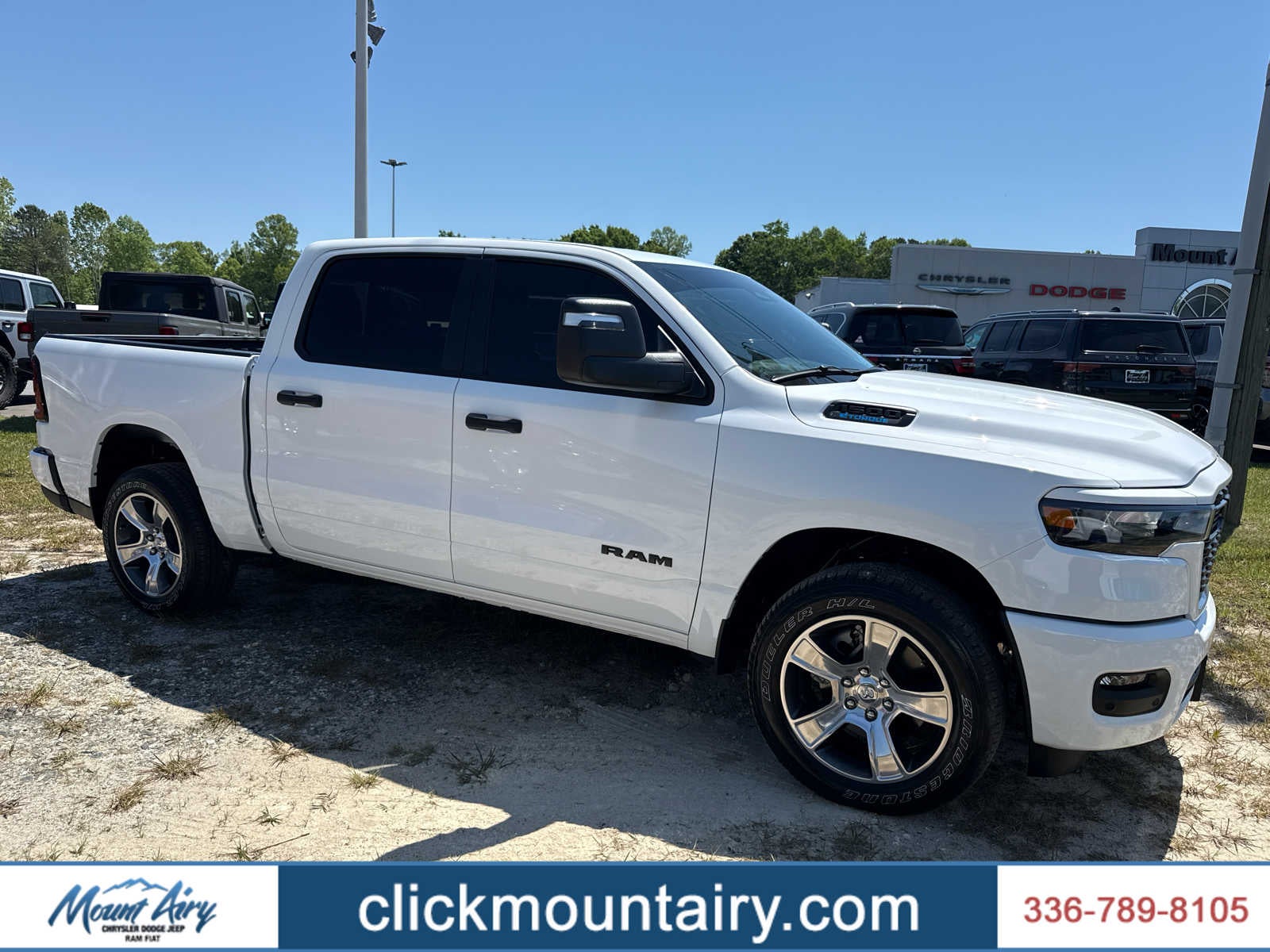 2025 RAM 1500 Tradesman Crew Cab 4x4 5'7' Box in Bright White Clearcoat — front three-quarter view