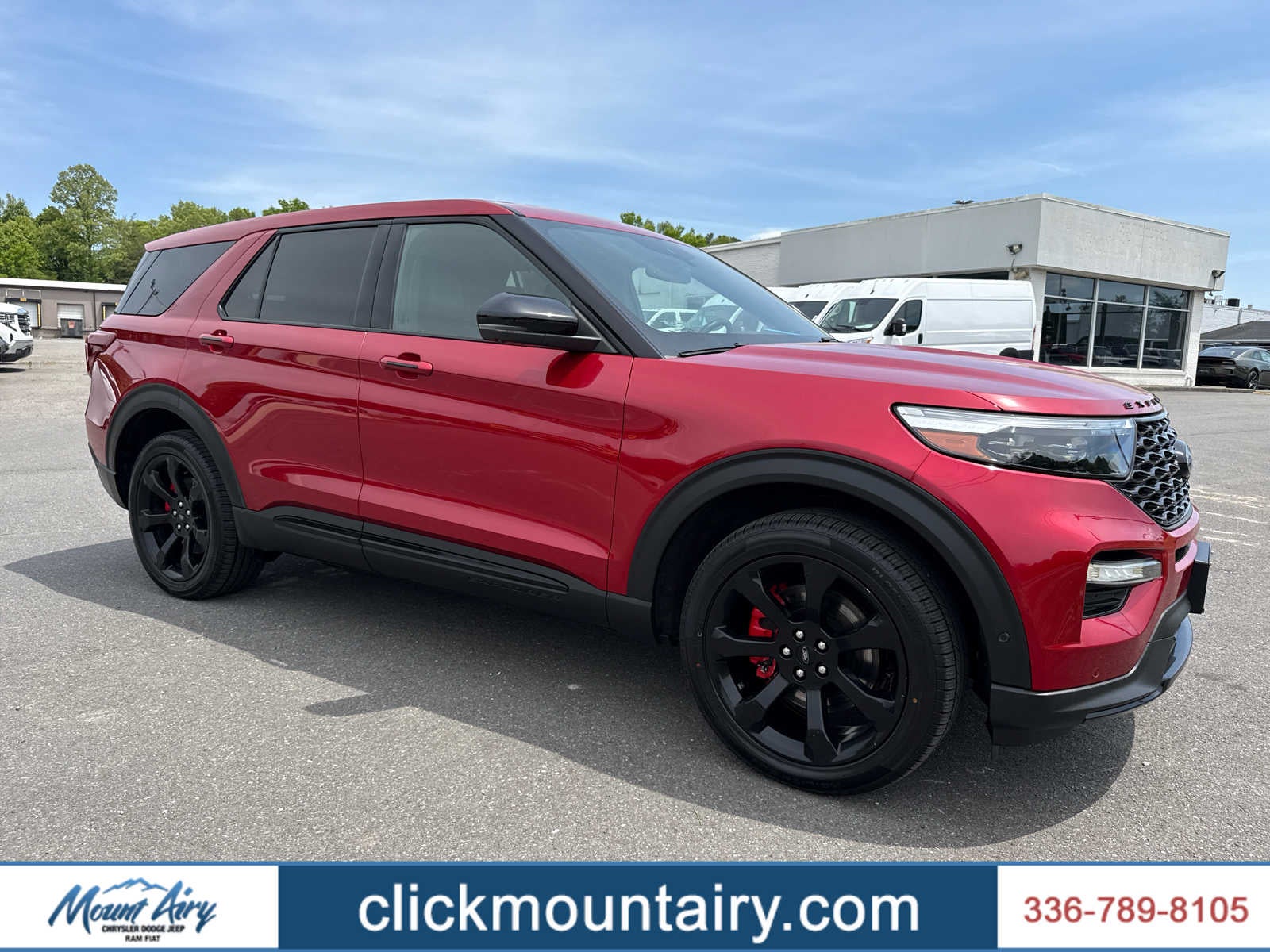 2022 Ford Explorer ST in Rapid Red Metallic Tinted Clearcoat — front three-quarter view