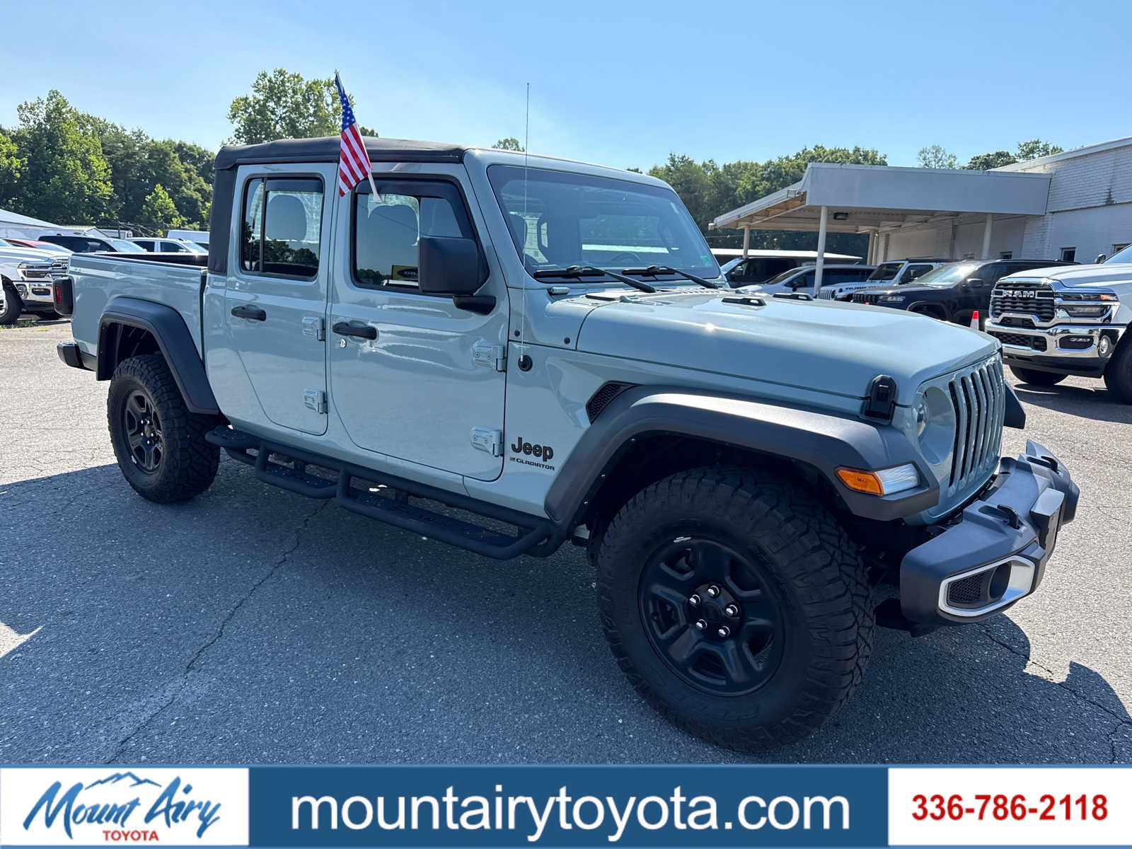 2023 Jeep Gladiator Sport in Limited Edition Earl Clearcoat — front three-quarter view