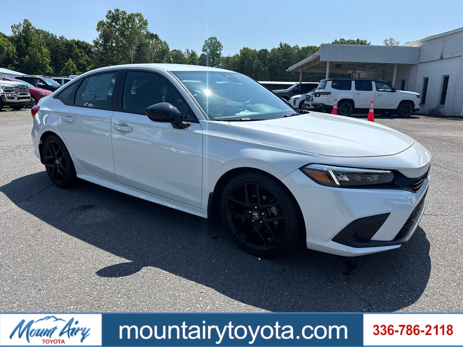 2024 Honda Civic Sport in Platinum White Pearl — front three-quarter view