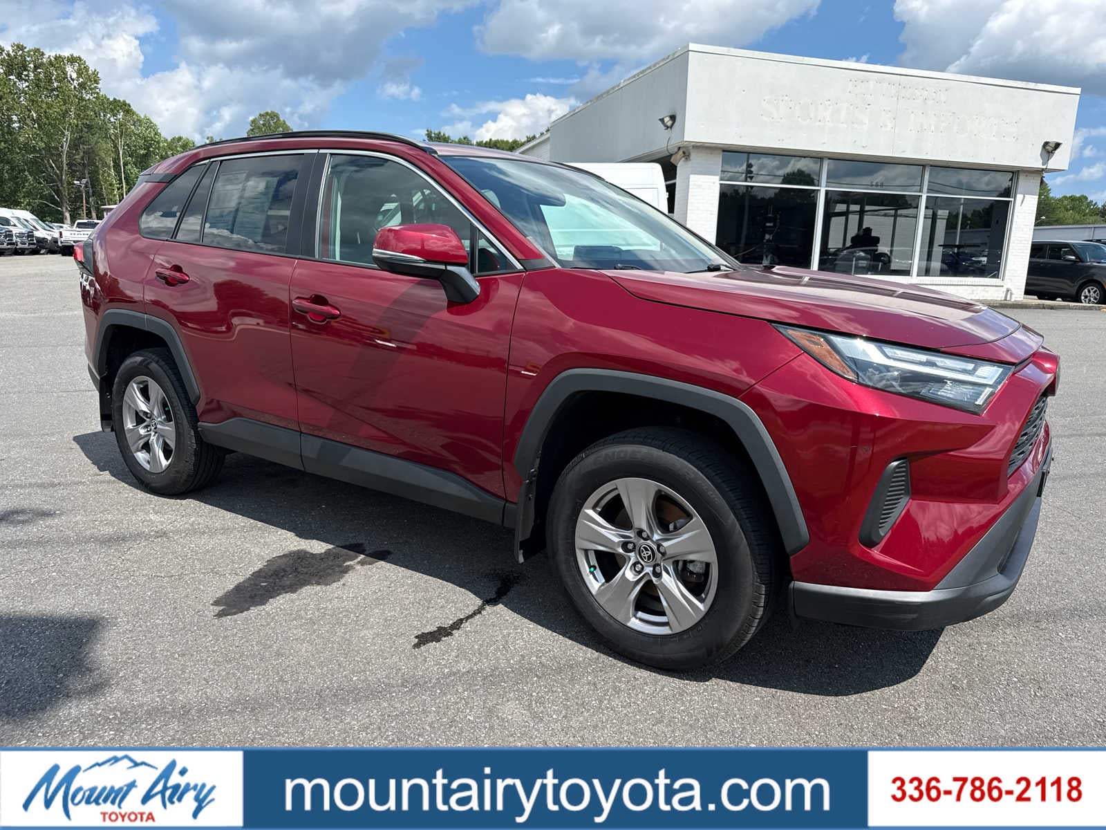 2023 Toyota RAV4 XLE in Ruby Flare Pearl — front three-quarter view