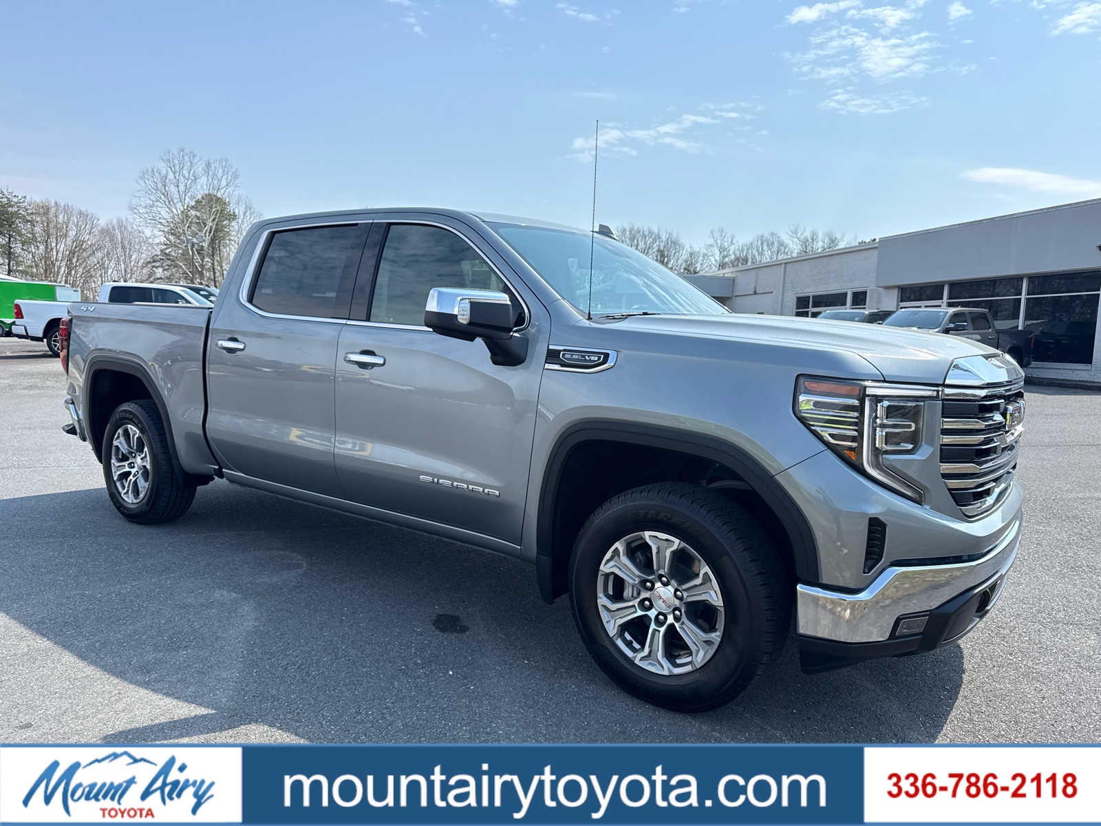 2025 GMC Sierra 1500 SLT in Sterling Metallic — front three-quarter view