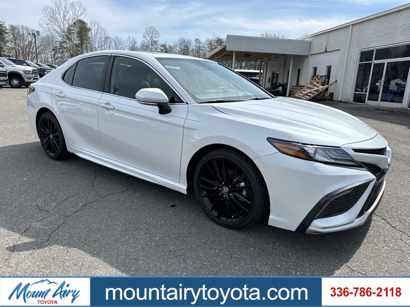 2024 Toyota Camry Hybrid XSE in Wind Chill Pearl — front three-quarter view