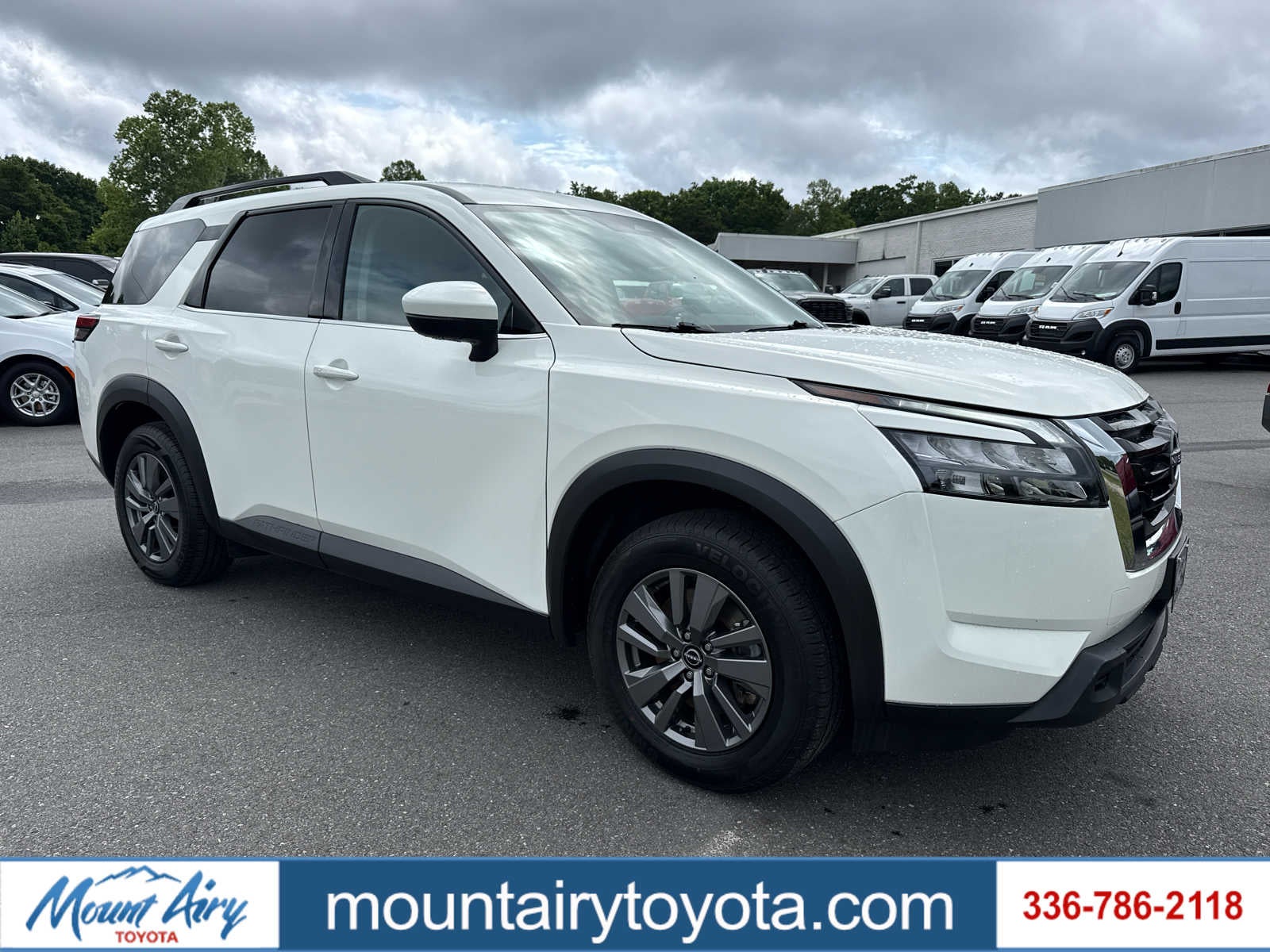 2025 Nissan Pathfinder SV in Glacier White — front three-quarter view