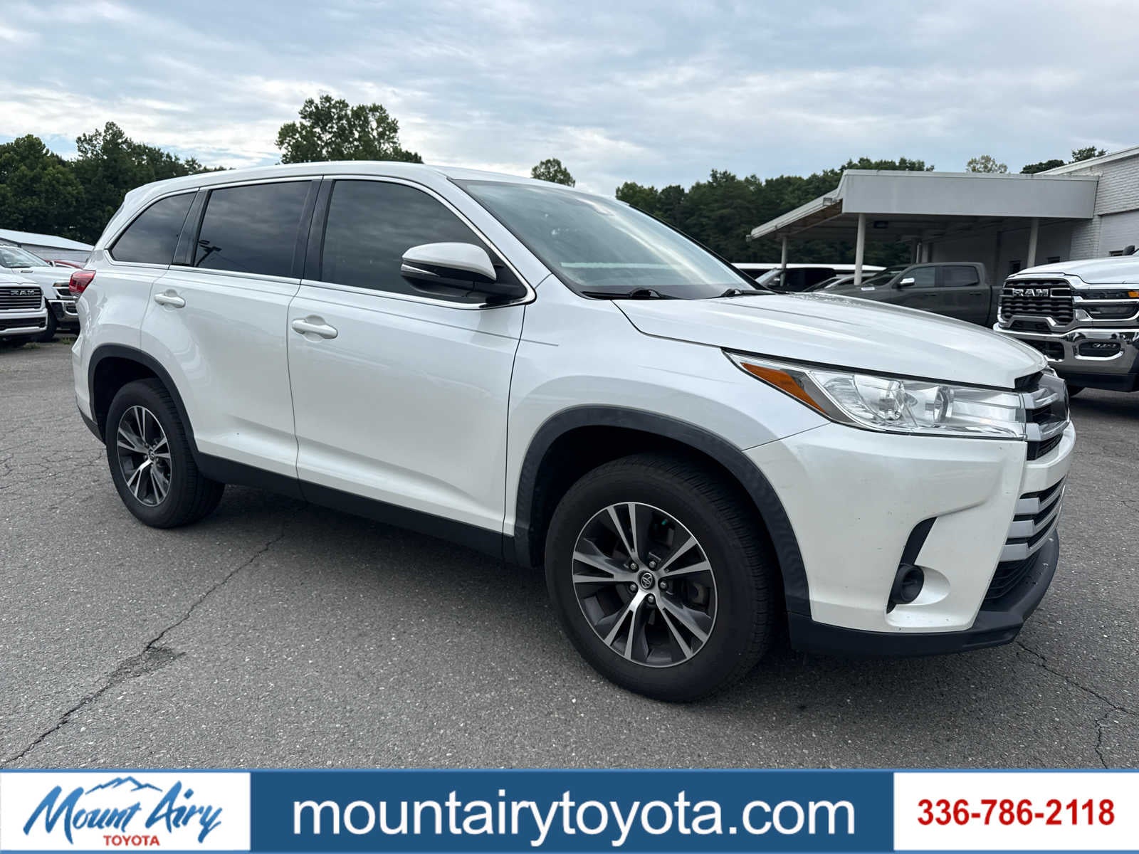 2019 Toyota Highlander LE in Blizzard Pearl — front three-quarter view