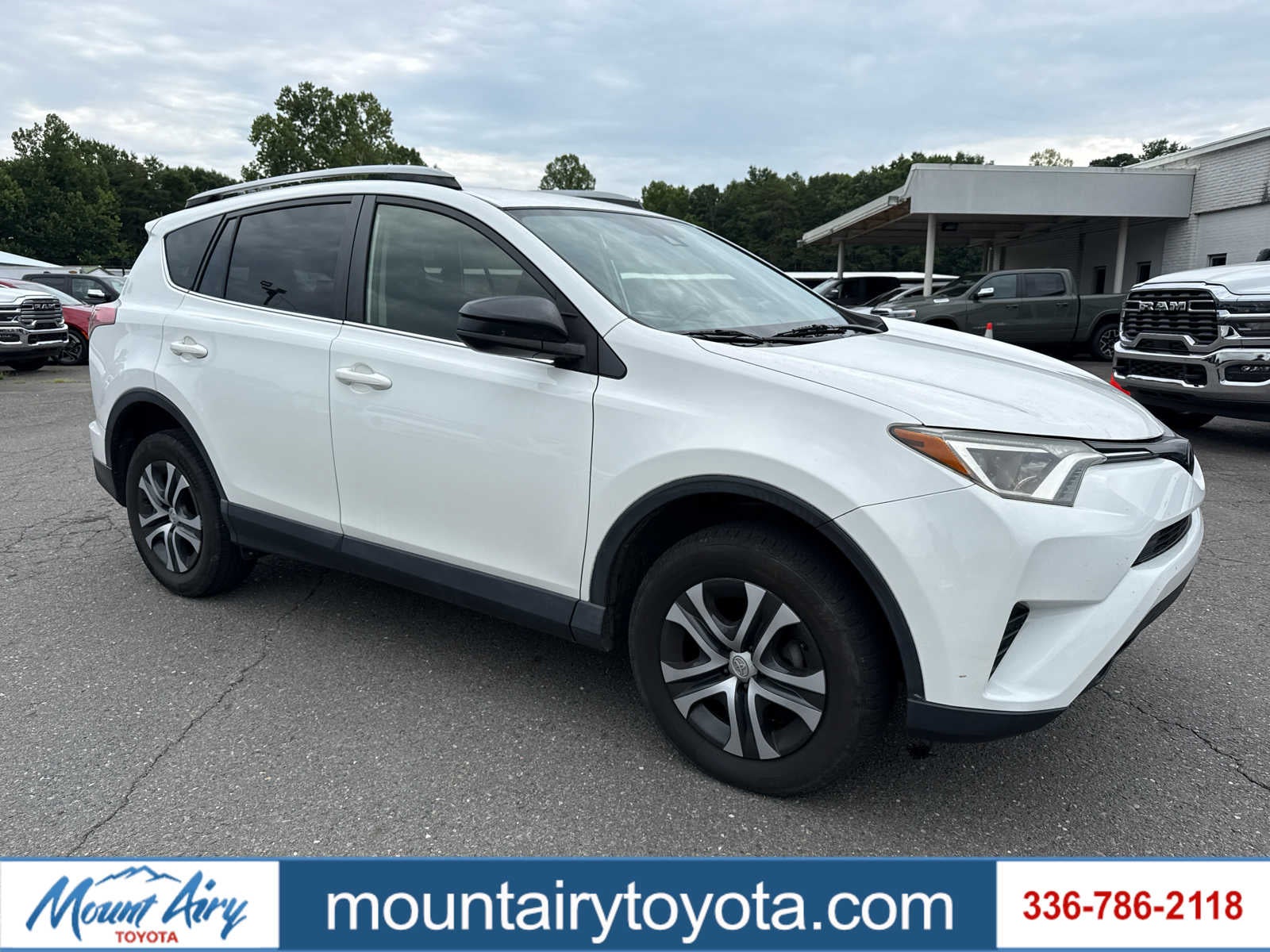 2018 Toyota RAV4 LE in Super White — front three-quarter view