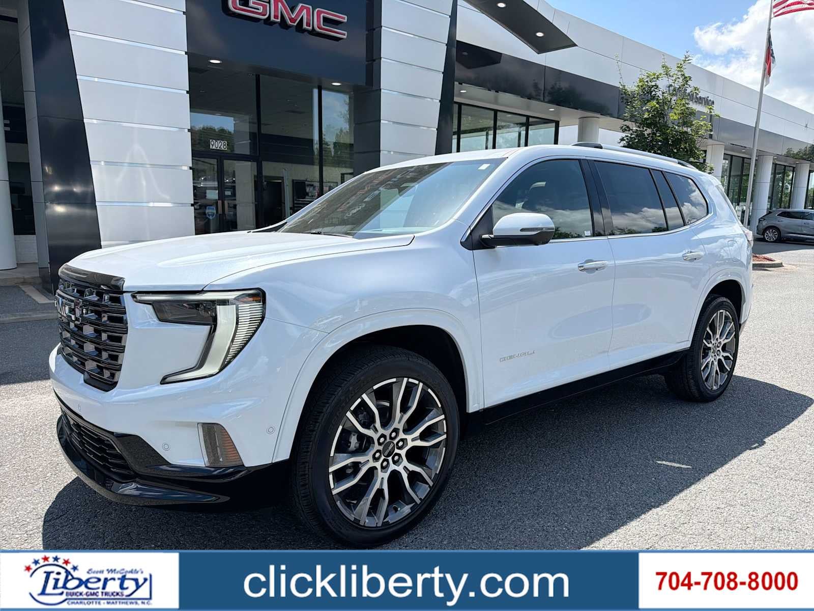 2026 GMC Acadia Denali Ultimate in Glacier White Tricoat — front three-quarter view