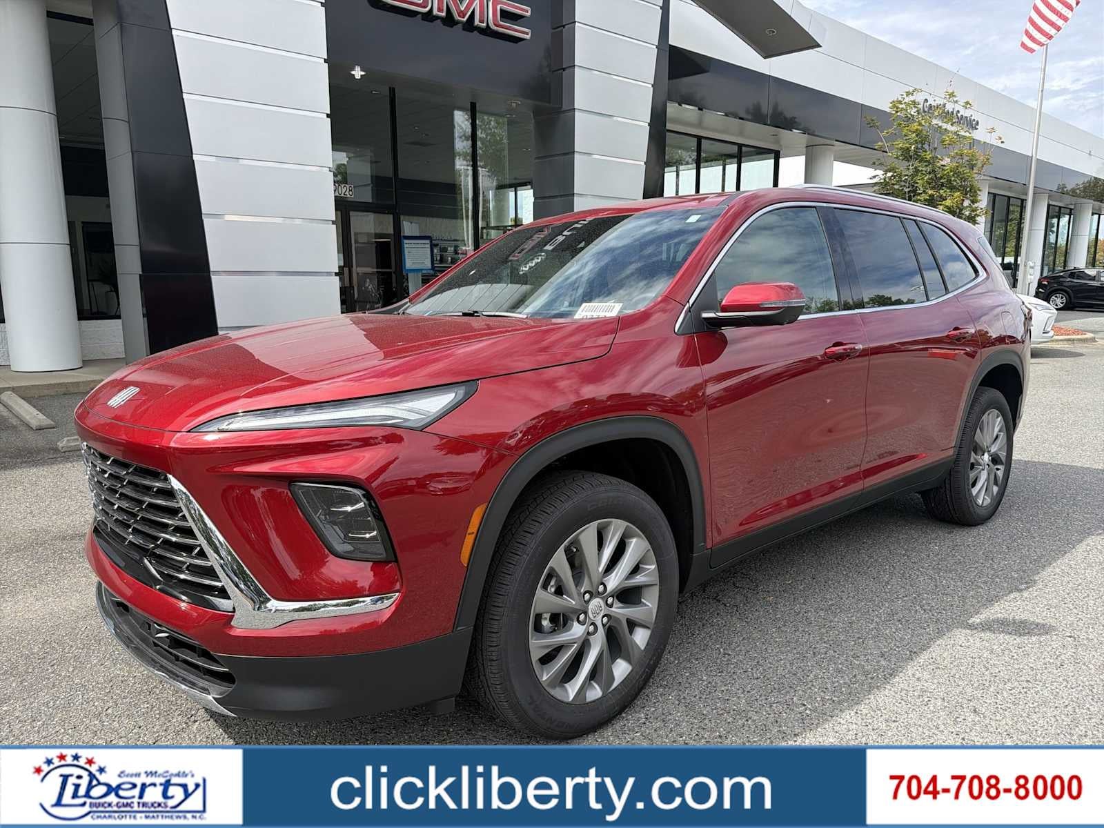 2026 Buick Enclave Preferred in Cherry Red Tintcoat — front three-quarter view