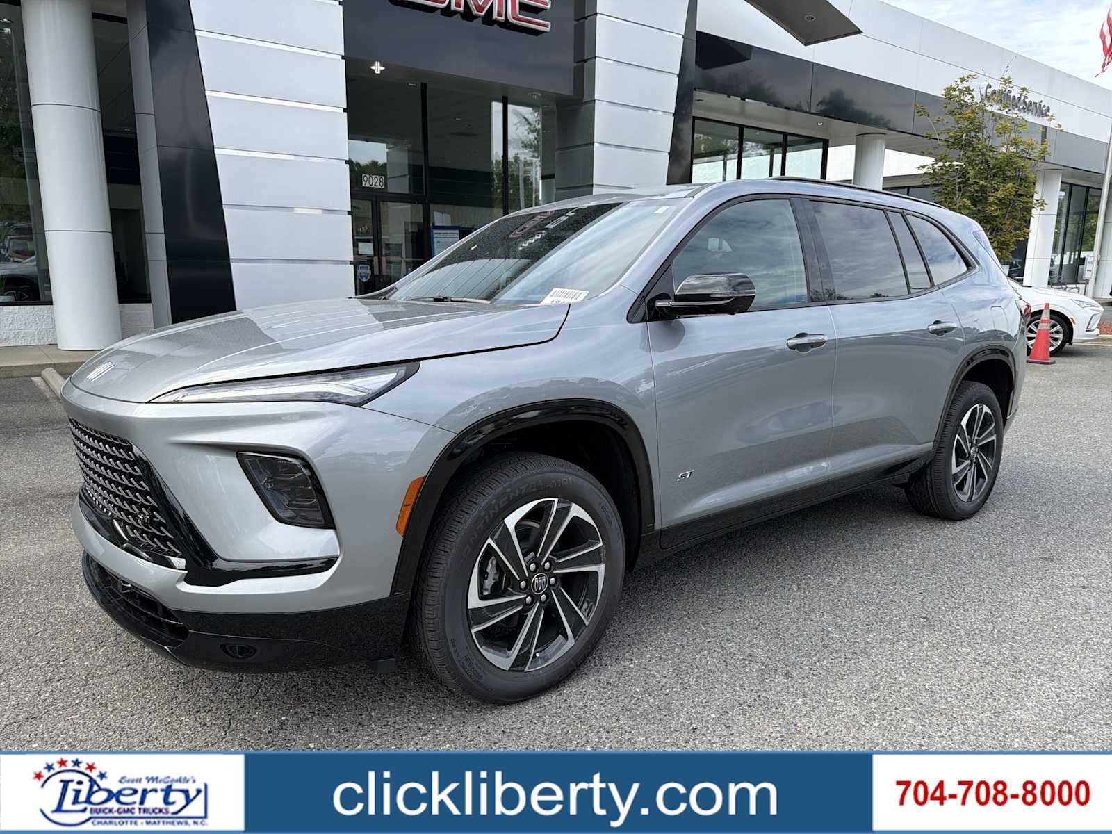 2026 Buick Enclave Sport Touring in Moonstone Gray Metallic — front three-quarter view