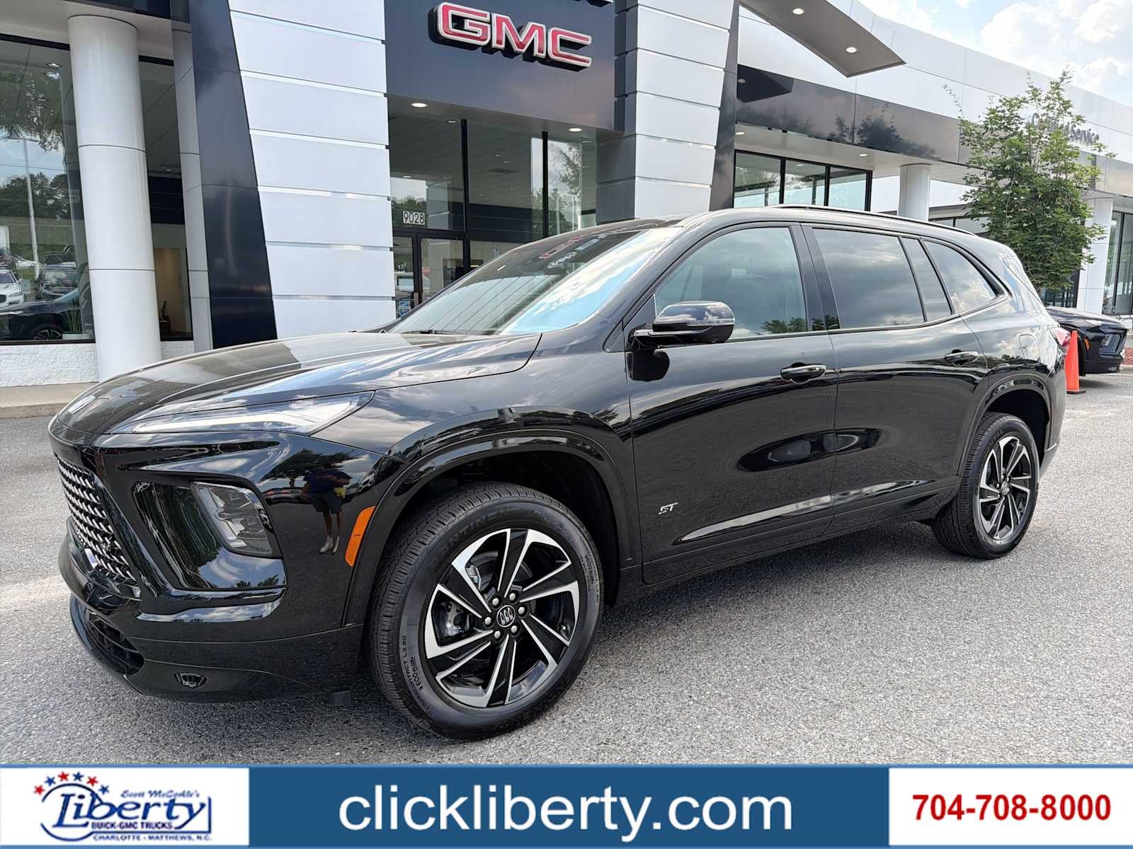 2026 Buick Enclave Sport Touring in Ebony Twilight Metallic — front three-quarter view