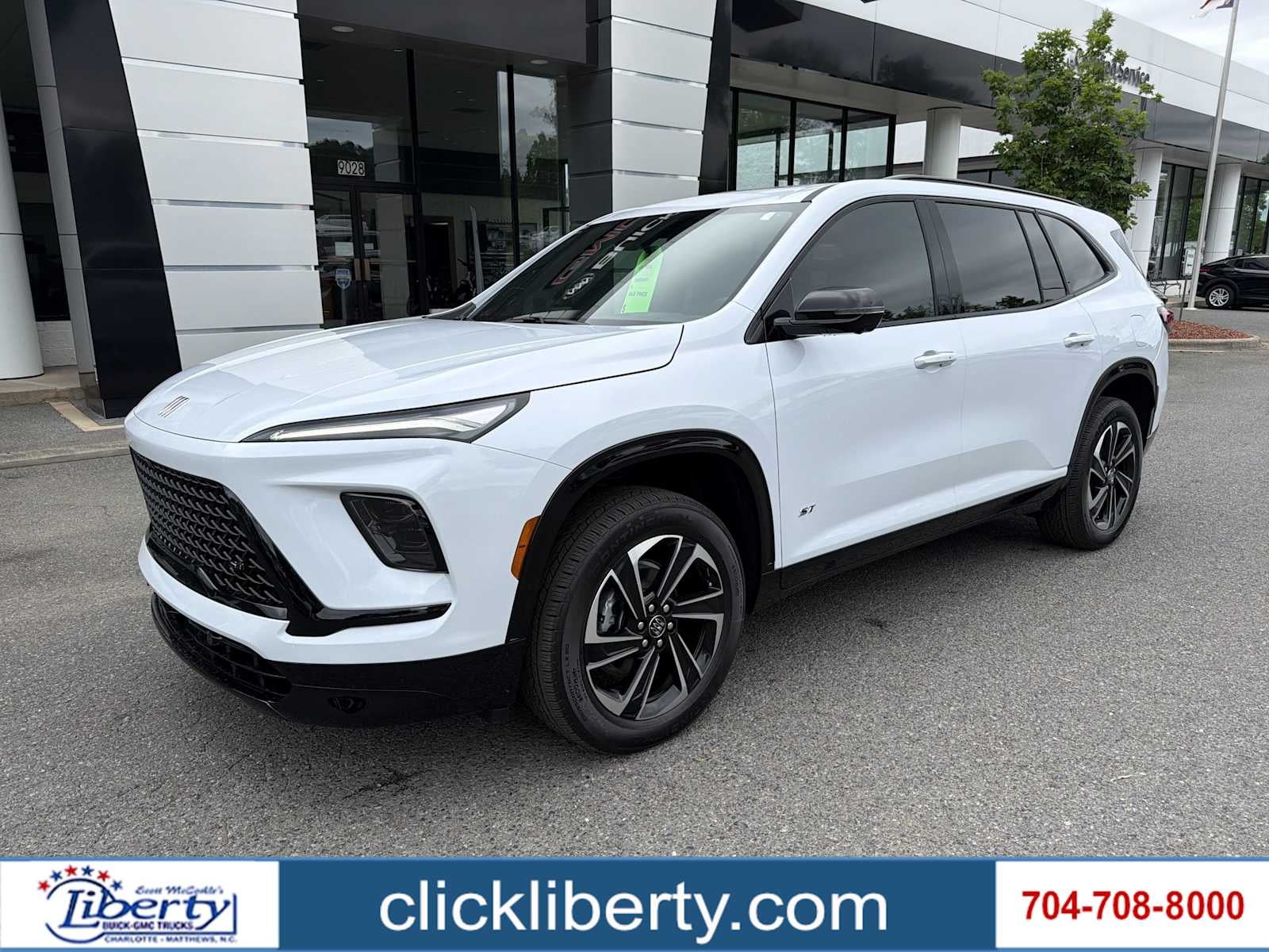 2026 Buick Enclave Sport Touring in Iridescent White Tricoat — front three-quarter view