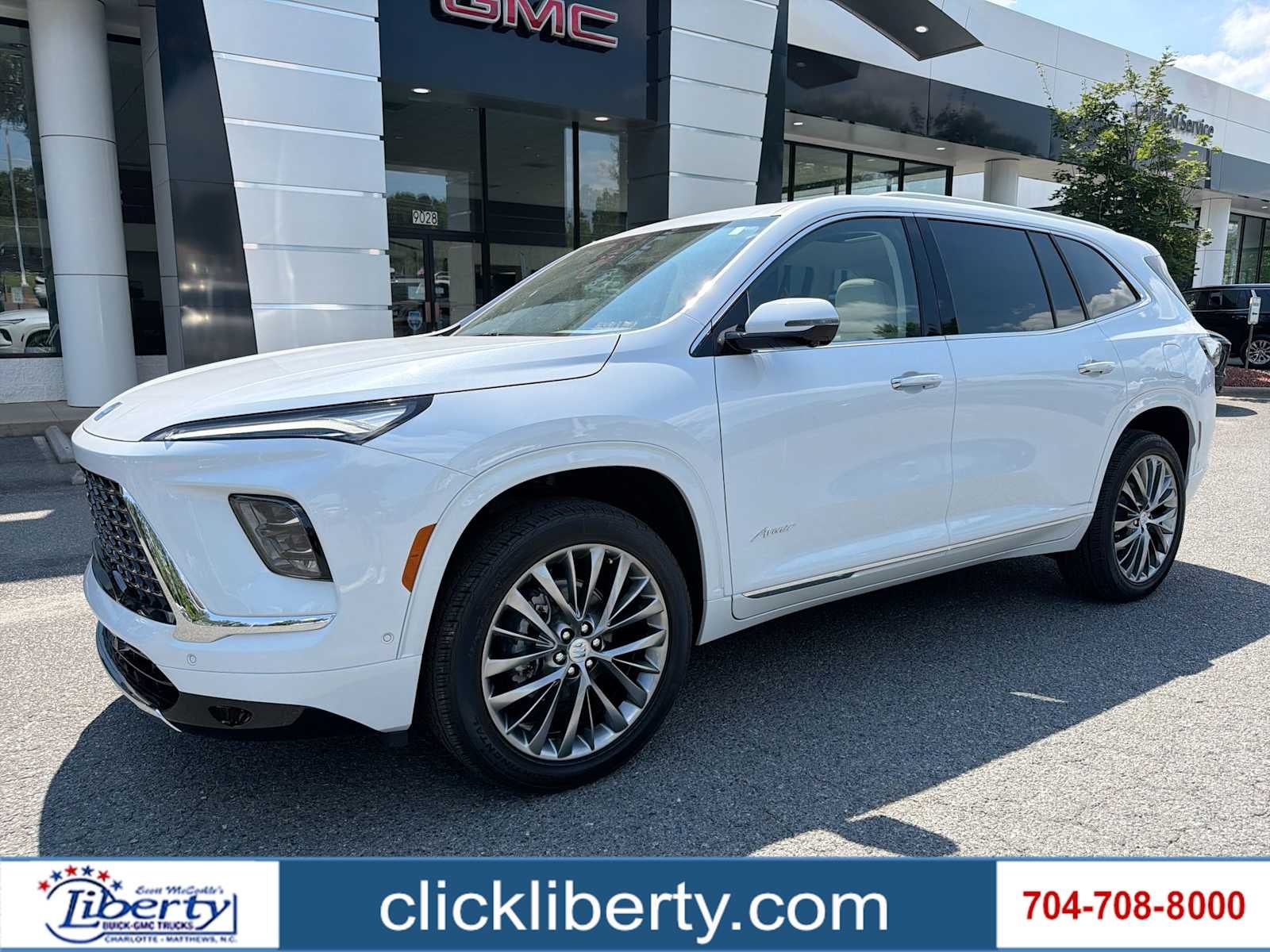 2026 Buick Enclave Avenir in Iridescent White Tricoat — front three-quarter view