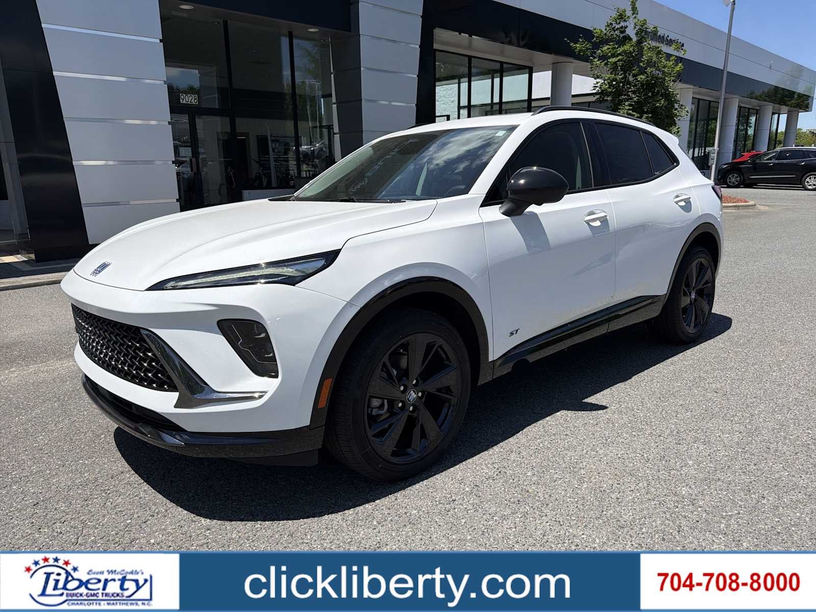 2026 Buick Envision Sport Touring in Summit White — front three-quarter view