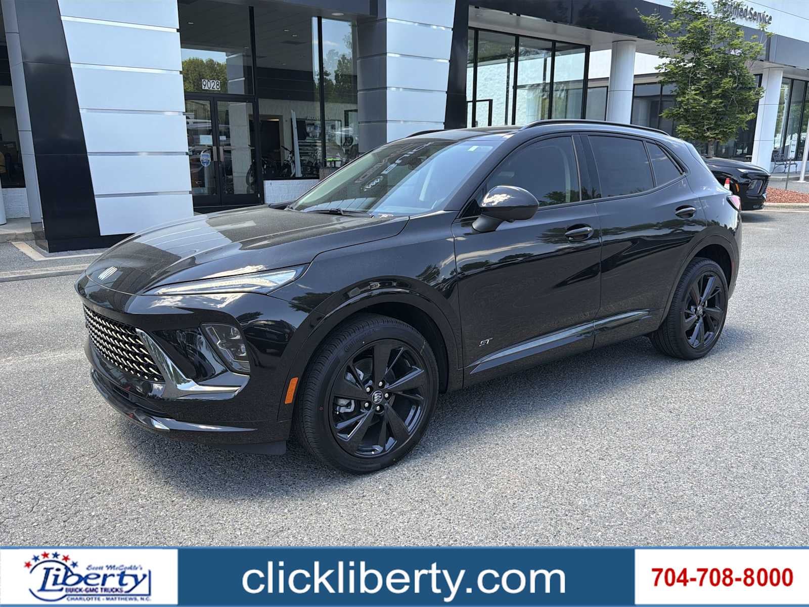 2026 Buick Envision Sport Touring in Ebony Twilight Metallic — front three-quarter view