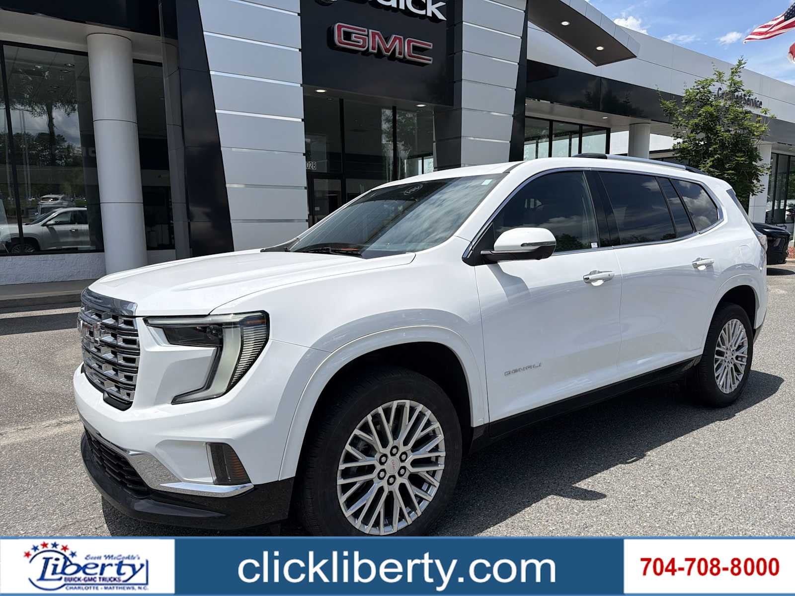 2024 GMC Acadia AWD Denali in Summit White — front three-quarter view