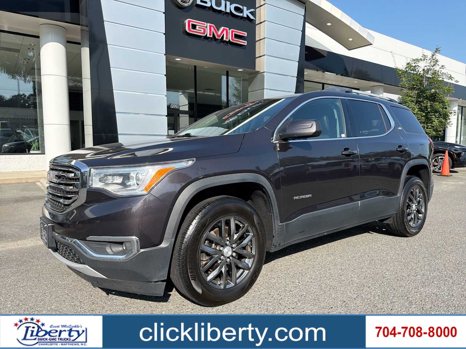 2017 GMC Acadia SLT in Iridium Metallic — front three-quarter view
