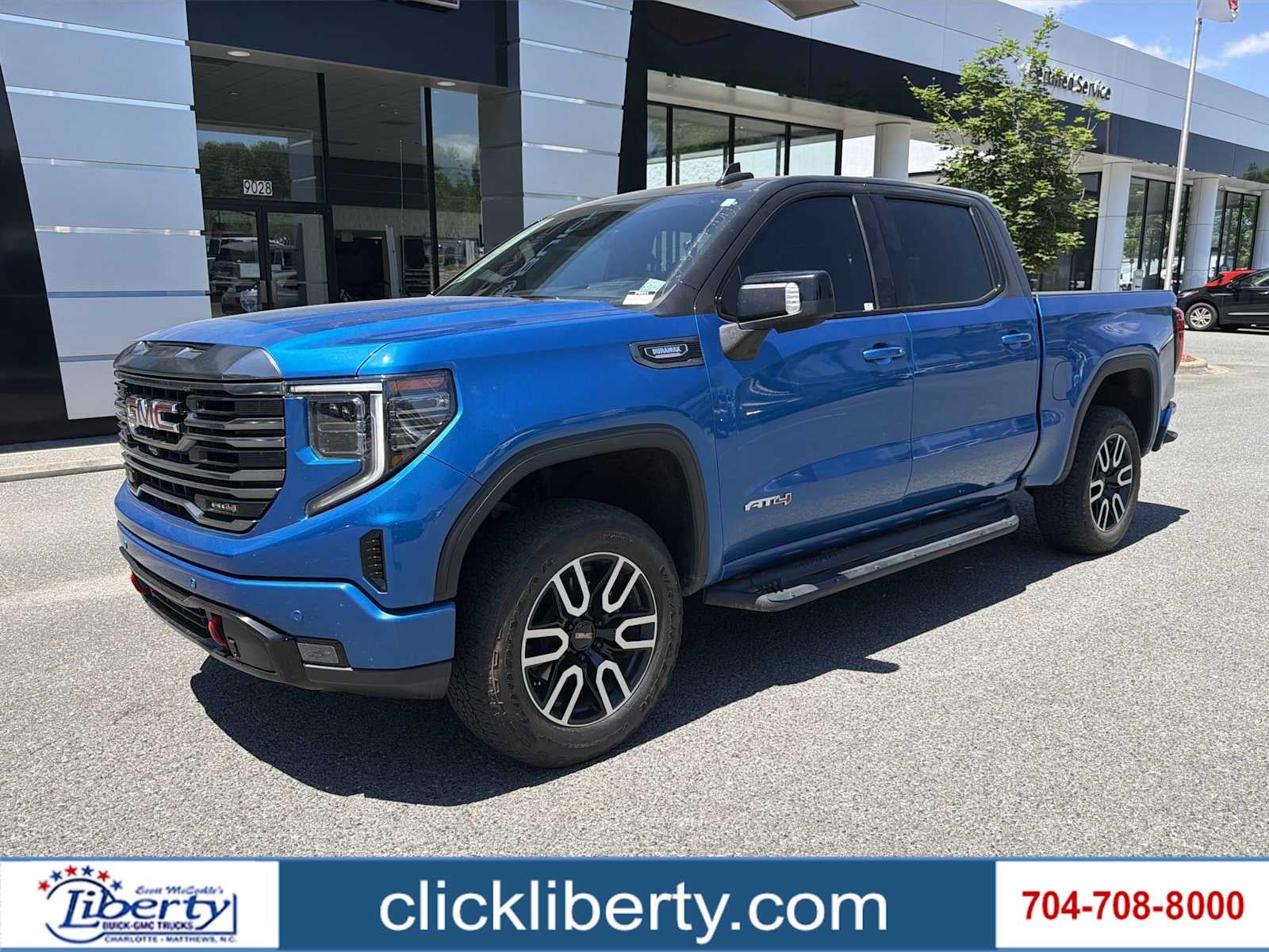 2023 GMC Sierra 1500 AT4 in Dynamic Blue Metallic — front three-quarter view