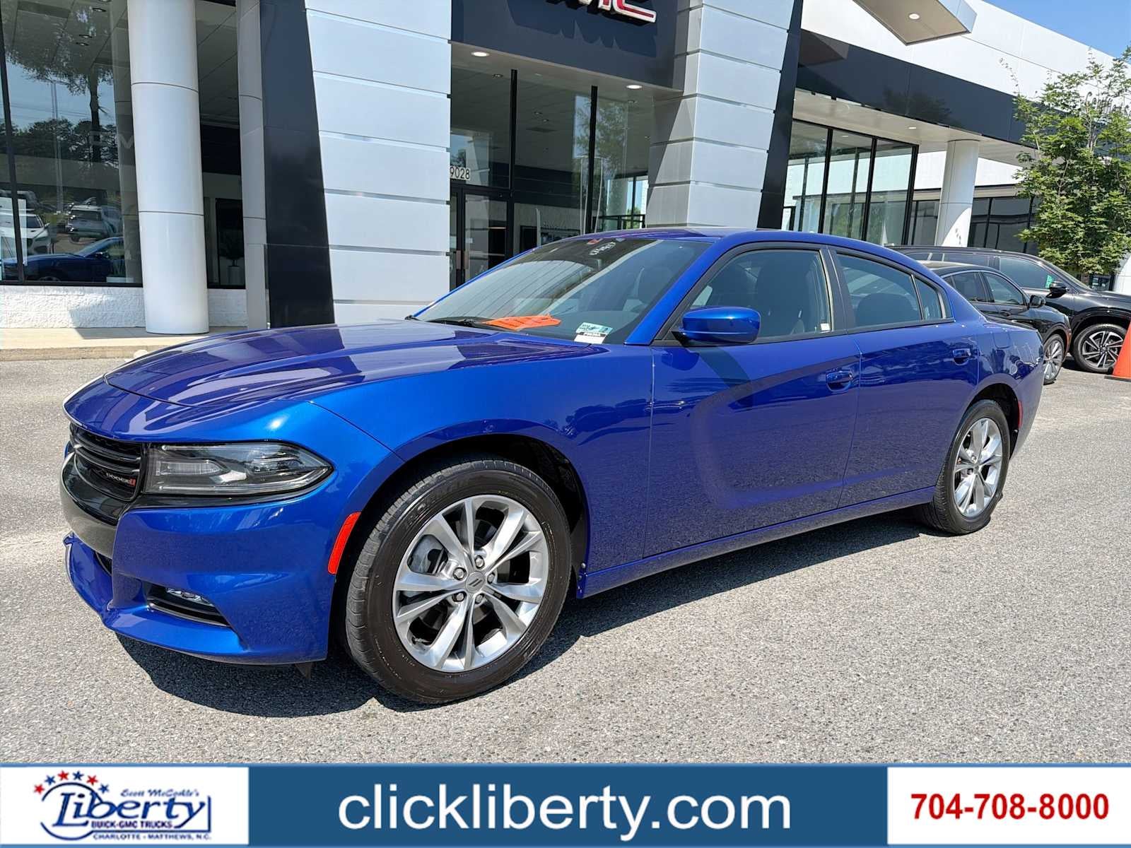 2021 Dodge Charger SXT in Indigo Blue — front three-quarter view