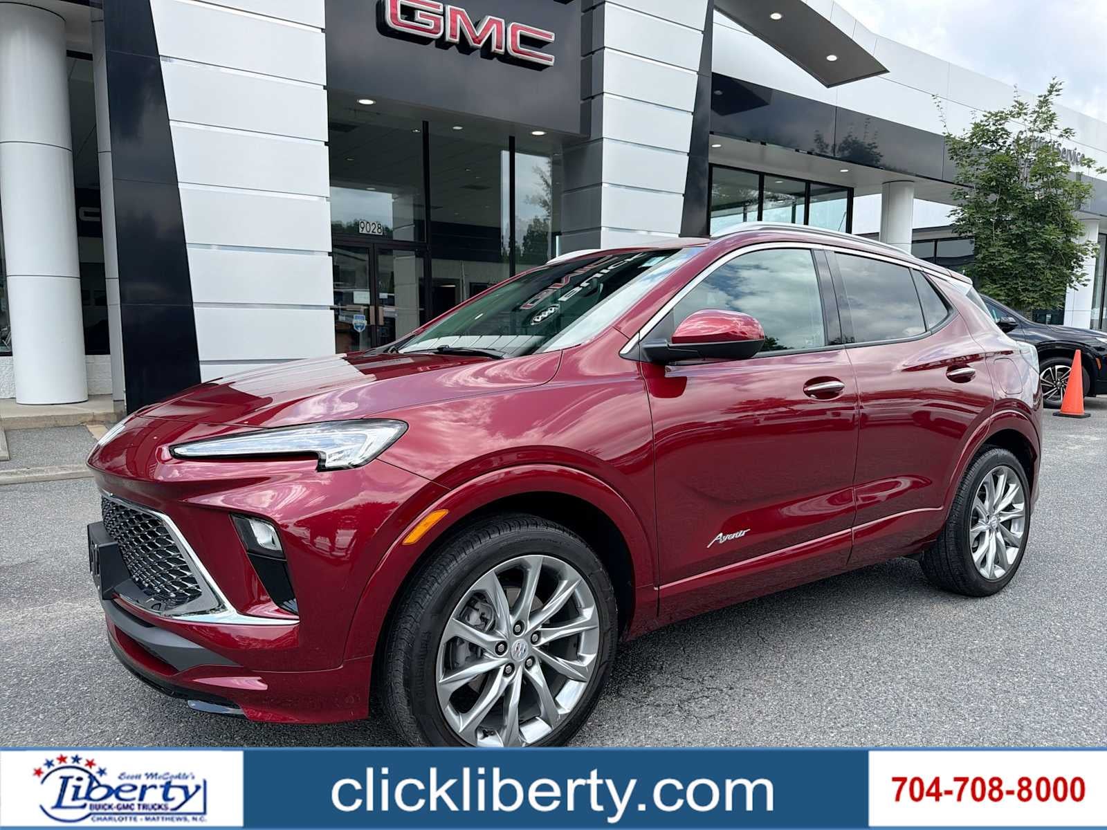 2024 Buick Encore GX Avenir in Cinnabar Metallic — front three-quarter view